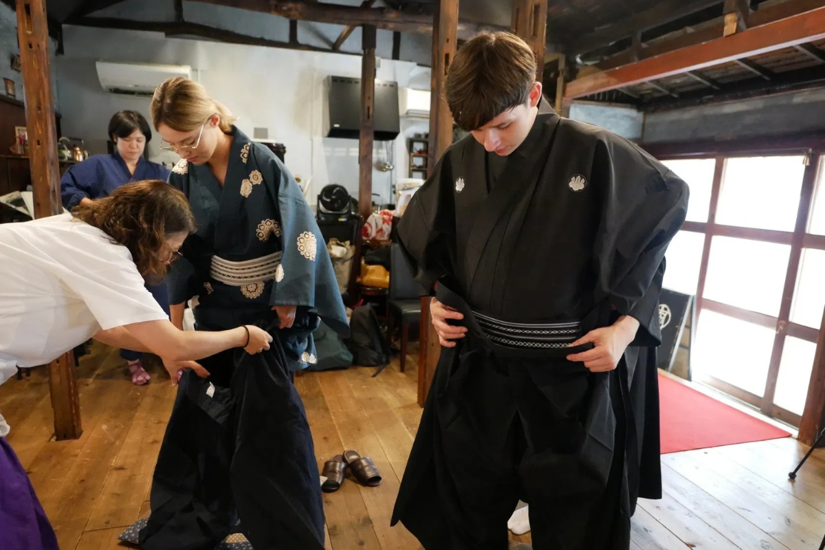 Guests dressing in authentic Samurai attire before the Bushido experience